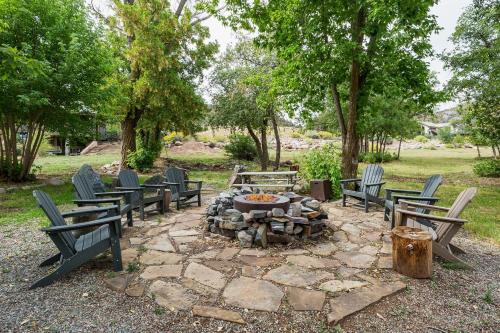 a fire pit in a park with benches and trees at CR 213 - Combo in Durango