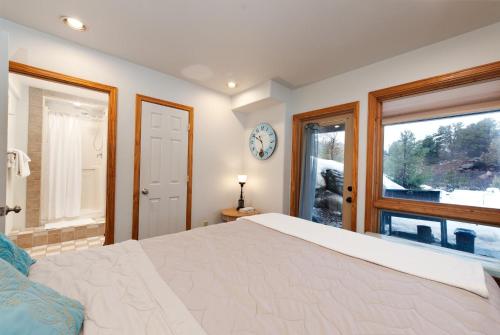 a bedroom with a large bed and a window at CR 213 - Combo in Durango