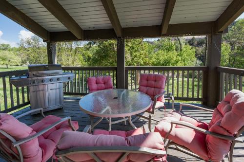 a patio with chairs and a table and a grill at CR 213 - Combo in Durango