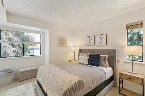 a bedroom with a bed and two windows at Boston Commons - 1263 in Greenwood Village