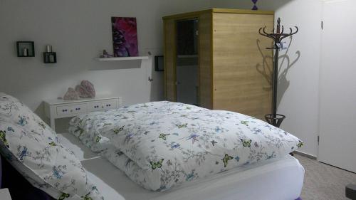 a bedroom with a bed with a pillow and a table at Unseburger Brauhaus GmbH Ferienwohnung 5 in Unseburg