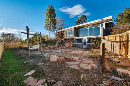 a house with a cross in front of a yard at Lunceford - Northglenn in Northglenn