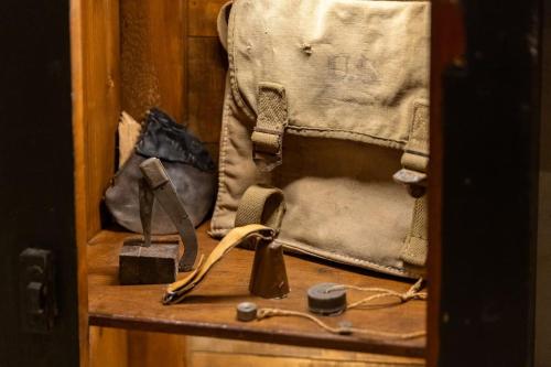 a wooden shelf with a bag and other items on it at Truffle House Tuscany Magnatum Pico in Montepulciano