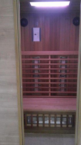 a room with a shelf of wine racks at Unseburger Brauhaus GmbH Ferienwohnung 5 in Unseburg