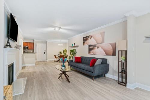 a living room with a couch and a fireplace at M1 - Private and serene 1bdr 1ba ensuite shared room in Atlanta