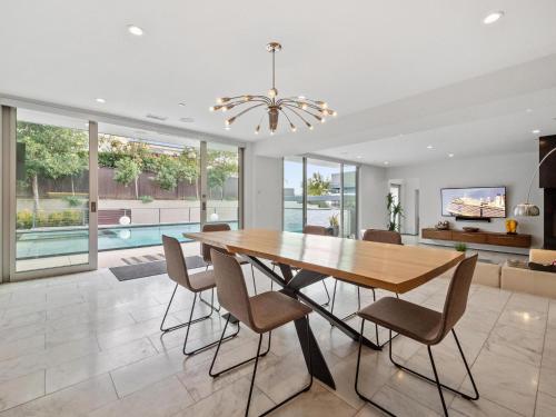 a dining room with a table and chairs at Luxury Coastal Home - Pool, Spa, AC, & Ocean Views in Solana Beach