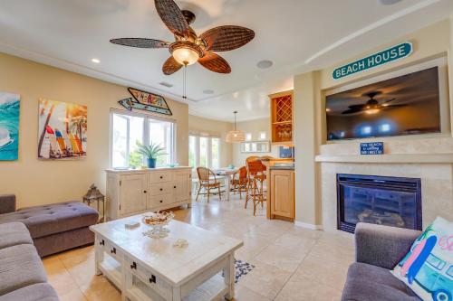 a living room with a couch and a fireplace at Stunning Ocean View Home w Rooftop Terrace, Firepit, Fast Wifi, AC & Parking! in San Diego