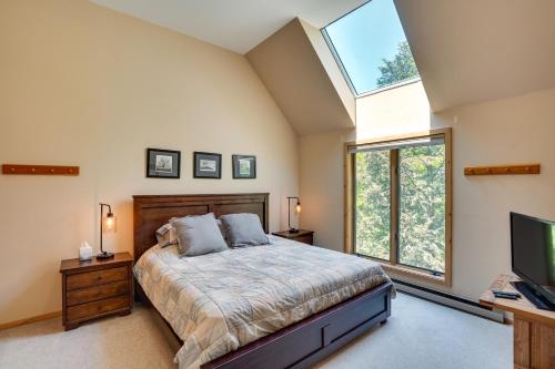 a bedroom with a large bed and a tv at Fantastic 2 family vacation home with EV charger in Windham