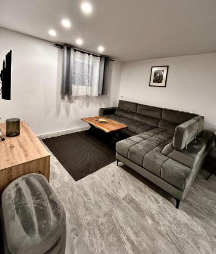 a living room with a couch and a table at My Appartements in Untertauern