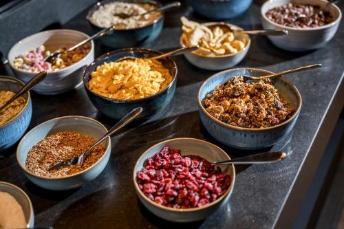 a table topped with bowls of different types of food at WITTMANNs in Neumarkt in der Oberpfalz