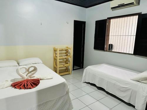 Katil atau katil-katil dalam bilik di Descanso da Preguiça, as margens do rio preguiça