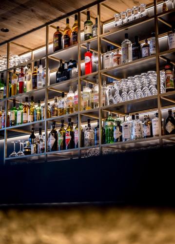 a shelf filled with lots of bottles of alcohol at WITTMANNs in Neumarkt in der Oberpfalz