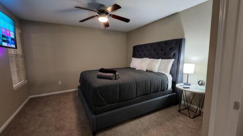 a bedroom with a bed and a ceiling fan at Med Center Charm 2br Haven in Houston