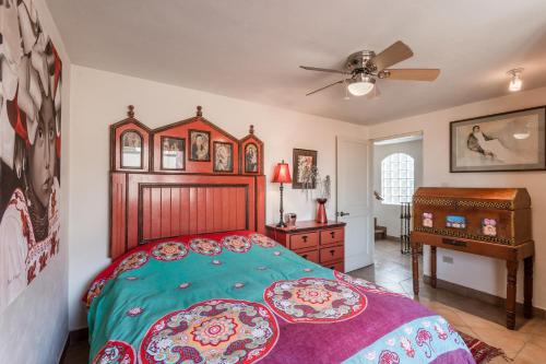 a bedroom with a bed and a dresser and a desk at Casa de la Vista in San Miguel de Allende
