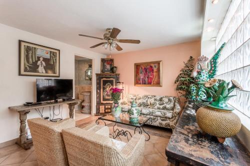 a living room with a couch and a table at Casa de la Vista in San Miguel de Allende