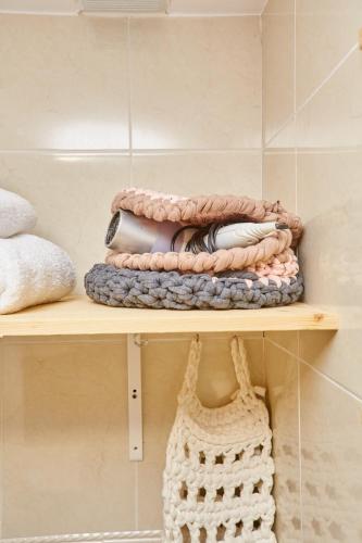 a shelf with a bunch of crochet items on it at Paraíso en Cala Llobeta in L'Ametlla de Mar