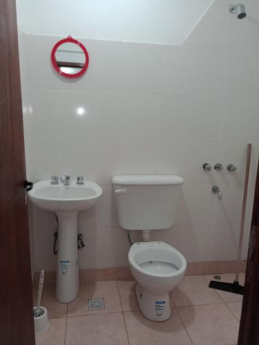 a bathroom with a toilet and a sink at Doña Guada in Humahuaca