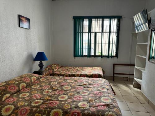 Un ou plusieurs lits dans un hébergement de l'établissement Hotel Cacts