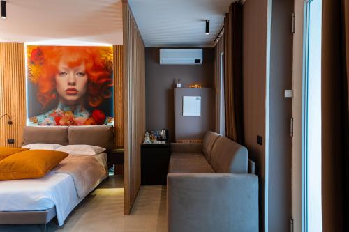 Postel nebo postele na pokoji v ubytování La Pergola Suites