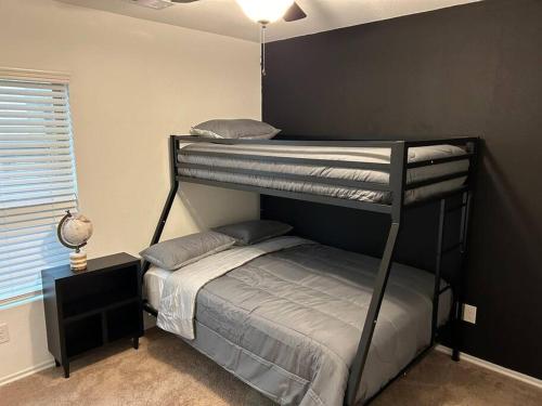 a bedroom with two bunk beds and a small bed at 4Bed 2Bath Entire Home 