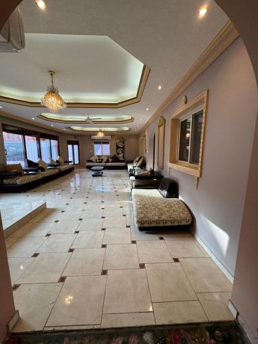a large living room with couches and a lobby at فيلا للإيجار اليومي جدة jar villa in Al Kura