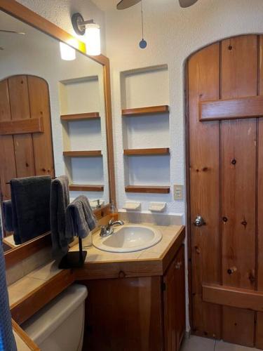 a bathroom with a sink and a mirror at Club la Costa- alberca, jacuzzi y caminando al mar in San José del Cabo