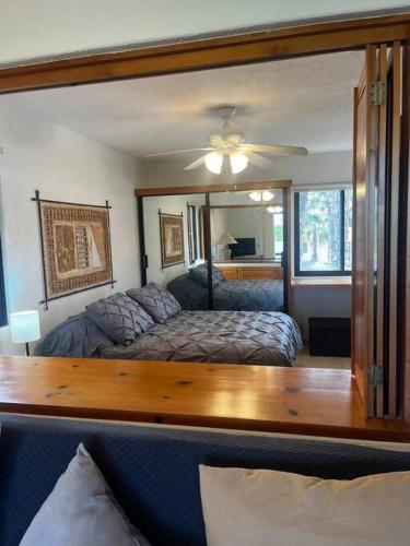 a bedroom with a bed and a large mirror at Club la Costa- alberca, jacuzzi y caminando al mar in San José del Cabo