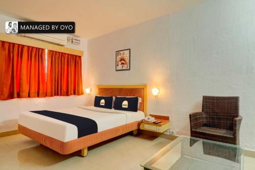 Posteľ alebo postele v izbe v ubytovaní Townhouse OAK SSV Grand Rai Durg