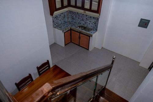 an overhead view of a staircase in a house at robiants apartment in Kinatilan