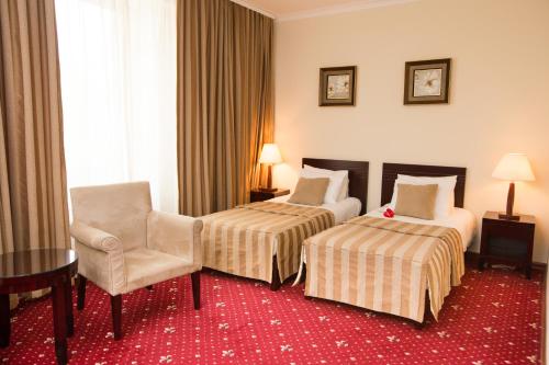 Postel nebo postele na pokoji v ubytování Jumbo Hotel