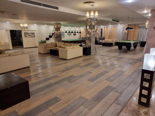 a lobby with couches and a pool table at شاليه لاجونا باي السخنه Chalet at laguna bay Sokhna in Ain Sokhna