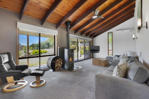 a living room with a couch and a fireplace at Bella Vista - Mansfield - Sleeps 8 in Mansfield
