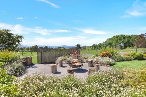 a fire pit in the middle of a garden at Bella Vista - Mansfield - Sleeps 8 in Mansfield