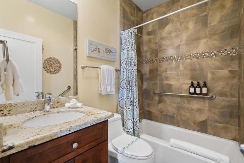 a bathroom with a sink and a toilet and a shower at Mission Paradise - Spa, Pet Friendly, Steps2Sand in San Diego
