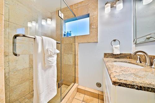 a bathroom with a sink and a shower at Stunning South Mission Home with Private Rooftop & Ocean Views! in San Diego