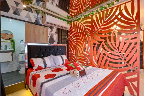 a bedroom with a bed with a box on it at La Suite 501 The Red Door in La Viva