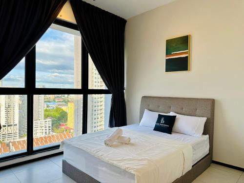 a bedroom with a bed with a large window at New 2BR or 3BR Cozy Urban Suite Homestay at Georgetown8-10pax by URBAN STAYCATIONS LOD in Jelutong