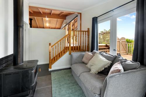 a living room with a couch and a fireplace at Mansfield Hideaway - Sleeps 10 in Mansfield
