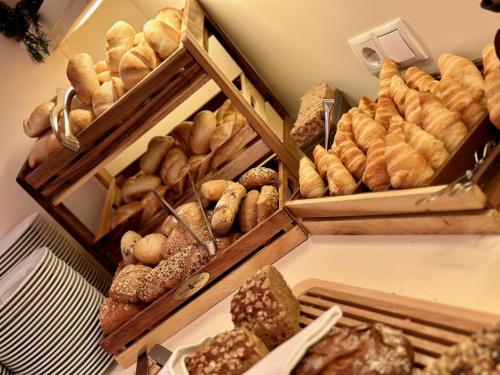 a bunch of different types of breads and pastries at Casinohotel Velden in Velden am Wörthersee