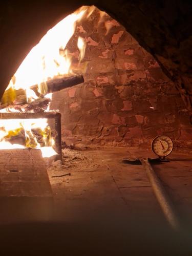 a brick oven with a fire in it at Myhoa Lagoon - Kiting Town in Phan Rang