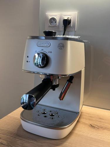 a coffee maker sitting on top of a table at WELLNESS Chalet OXY in Ždiar