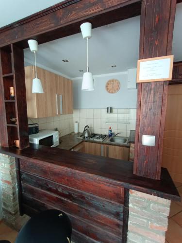 a kitchen with a large wooden counter top at Mieszkanie w centrum in Kłodzko