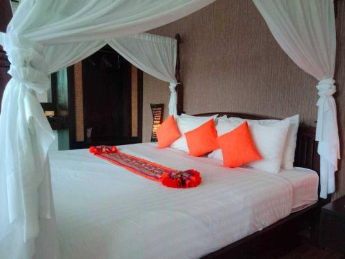 Jingjit Hotelにあるベッド