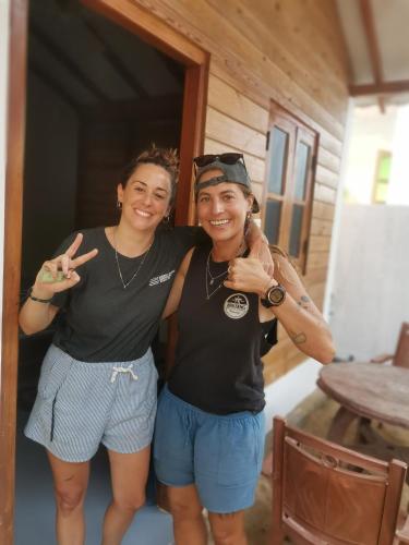 two women standing next to each other posing for a picture at Bashi eco beach cabana in Trincomalee