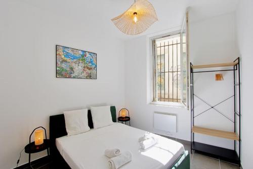 a white bedroom with a bed and a window at FLC-PANIER- OLD PORT 500m - T3- 2 Bedrooms -Maxi 6 Guests in Marseille