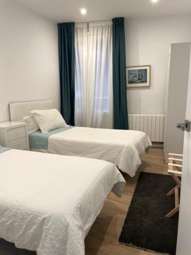 Postel nebo postele na pokoji v ubytování Gran bilbao vistas impresionantes a estrenar