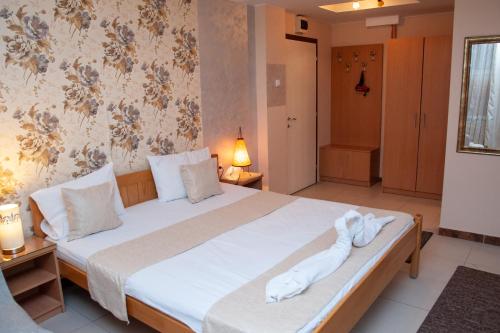 Ένα ή περισσότερα κρεβάτια σε δωμάτιο στο Hotel North City