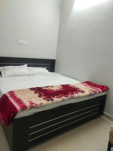 Ένα ή περισσότερα κρεβάτια σε δωμάτιο στο Pink City Backpackers