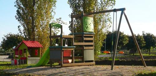 a playground with a slide and a swing at Country House Casco Dell'Acqua in Trevi