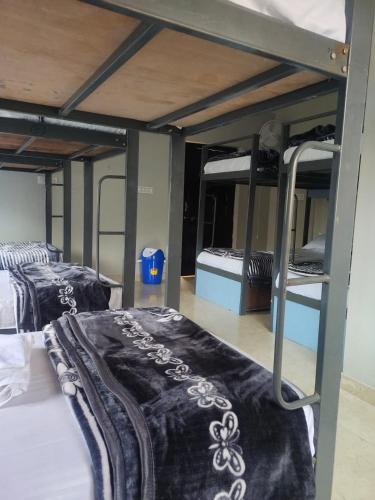Ένα ή περισσότερα κρεβάτια σε δωμάτιο στο Pink City Backpackers